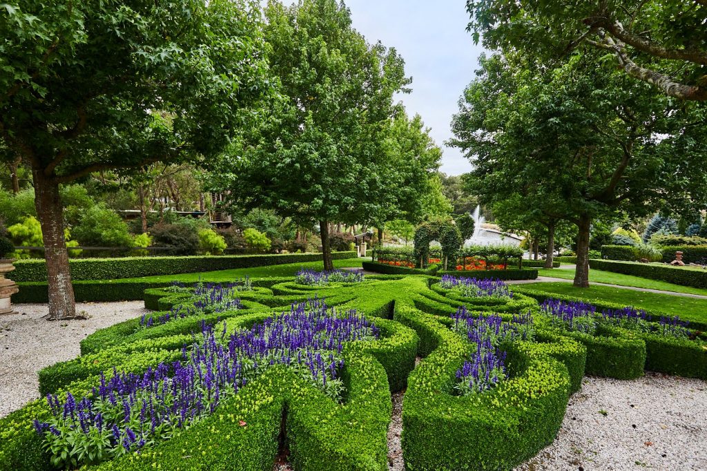 Lush and colourful formal gardens and lake area at Enchanted Adventure